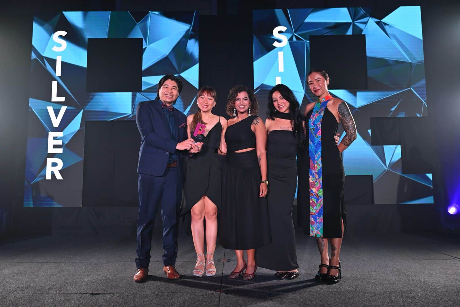 Vox Group team holding A+M PR Awards Singapore 2025 trophies